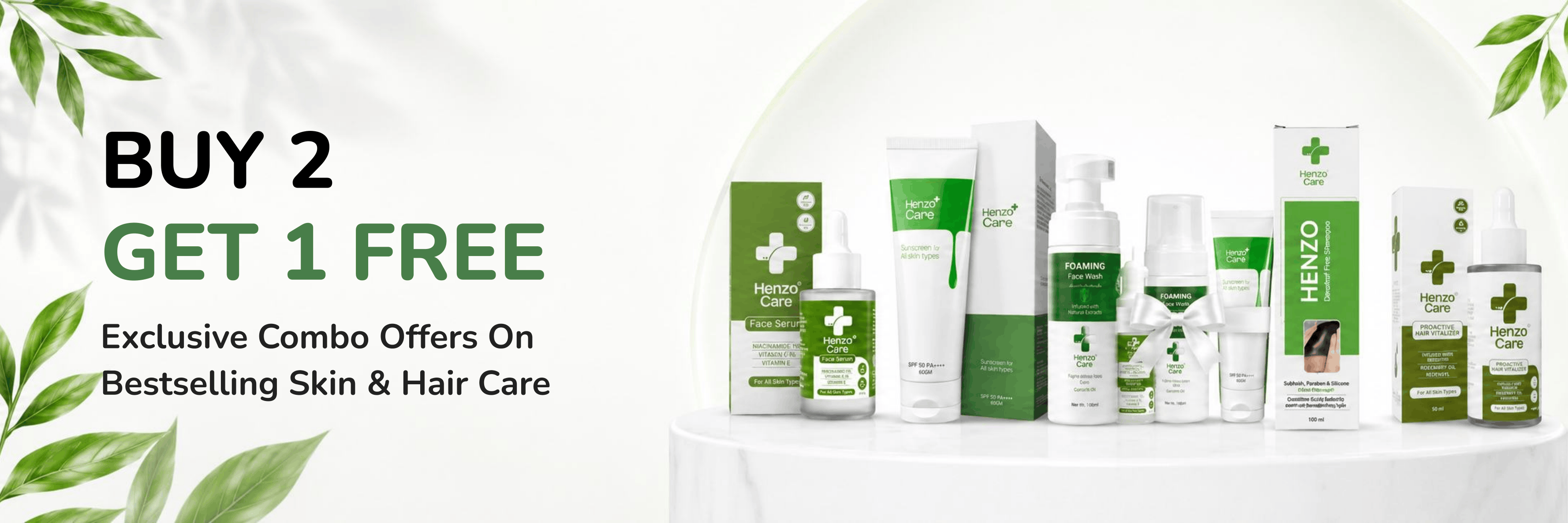 Promotional banner for a skincare and hair care combo offer, featuring multiple green and white product bottles and boxes on a white table against a light background. Text on the left reads 'BUY 2 GET 1 FREE' and 'Exclusive Combo Offers On Bestselling Skin & Hair Care'.